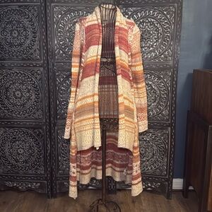 Free People long cardigan. in Great pre-own condition. Size  XS.